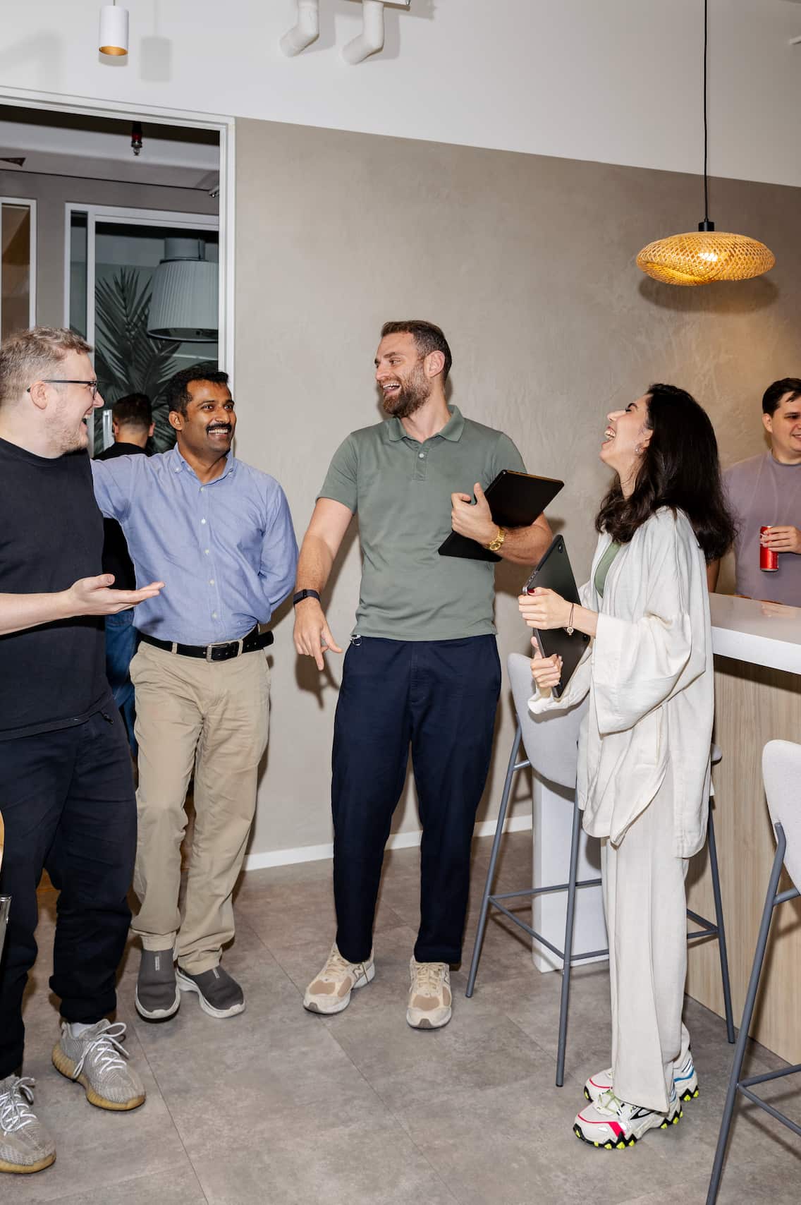 A group of people talking and laughing